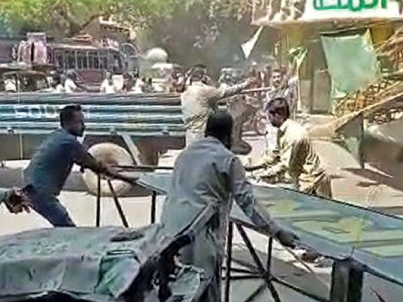 file photo shows kmc officials removing signboard of burns road food street and other encroachment on court orders photo express file