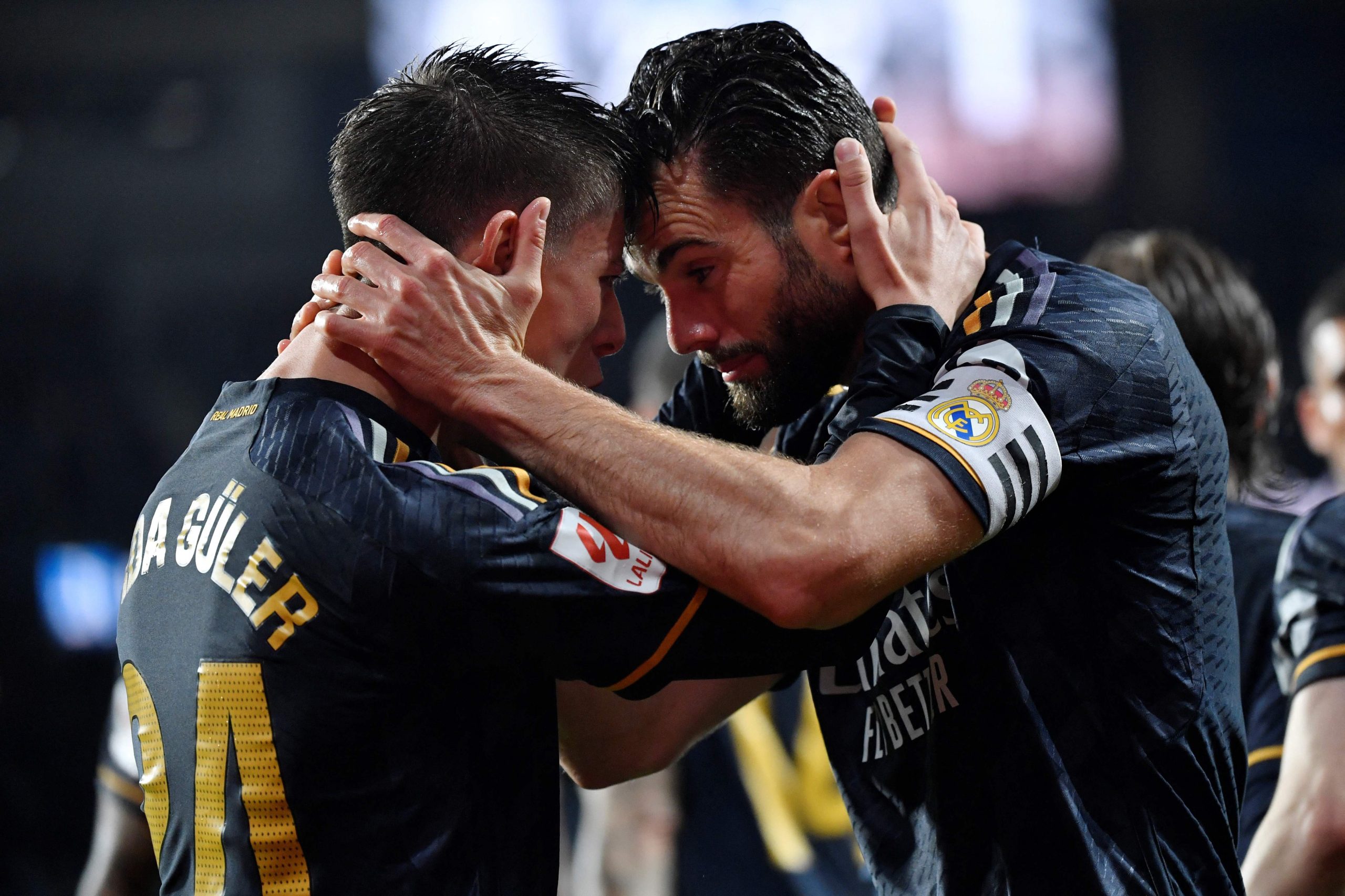 marvelous real madrid s midfielder arda guler l celebrates with defender nacho fernandez scoring his team s first goal against real sociedad at the anoeta stadium photo afp