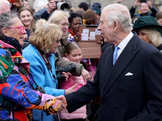 britain s king charles and queen camilla greet people after attending the easter matins service at st george s chapel windsor castle britain march 31 2024 photo reuters