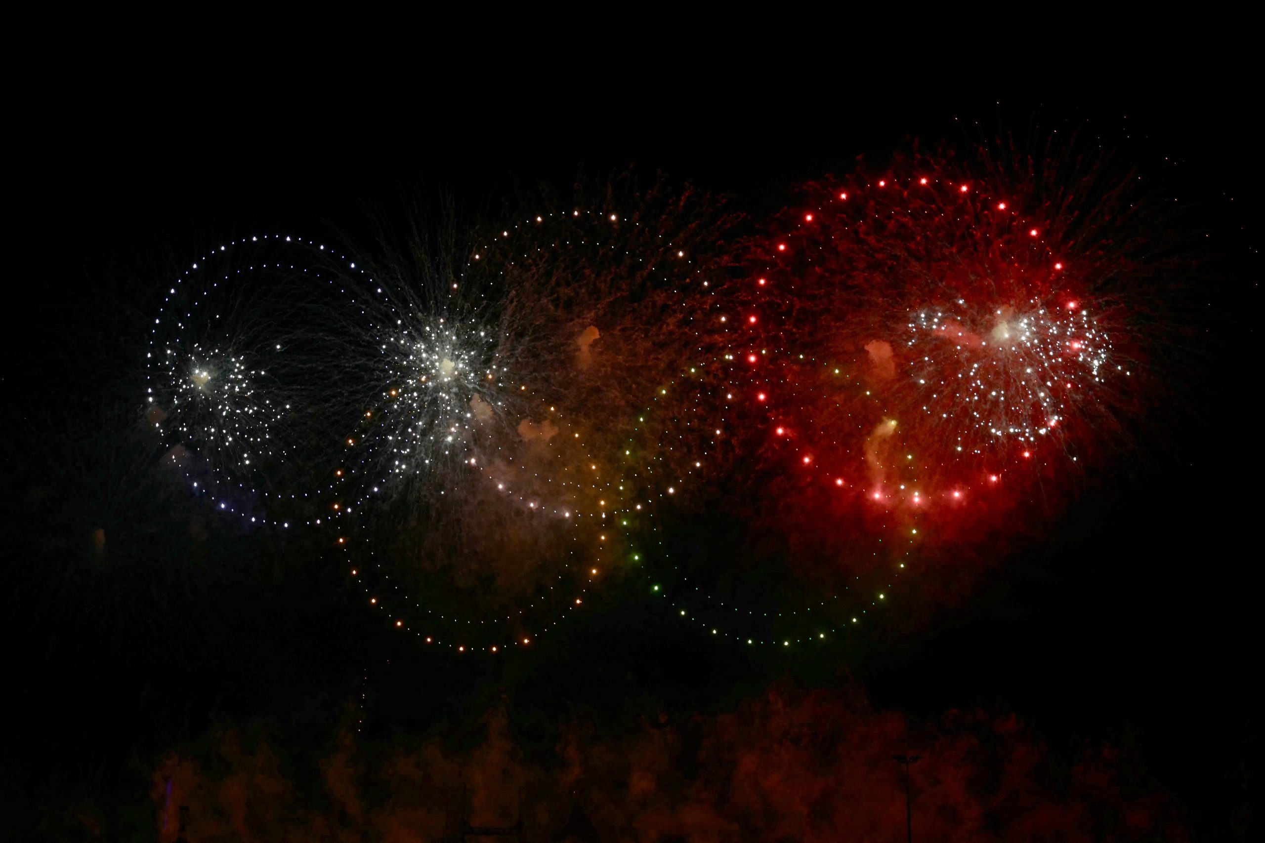 determined some 800 light drones and fireworks on the theme of olympic fire light the skys to celebrate the upcoming arrival of the olympic flame in france for the opening ceremony of the paris 2024 summer olympic photo afp