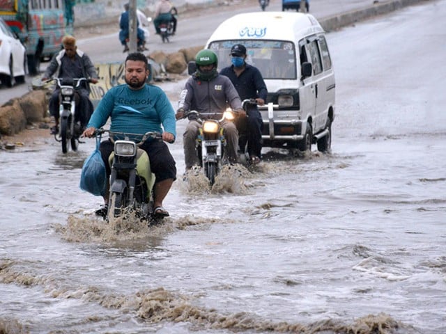 vehicles passing through rain water at karachi s korangi road on april 14 2024 photo app