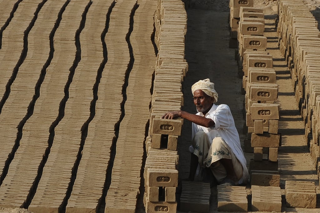 a labourer captures as he works photo express